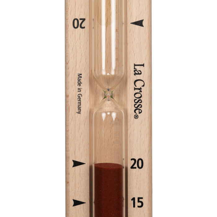 Close up detail of the hourglass tube of the 918-631 Sauna Hourglass Timer showing the wood casing, glass tube, and red sand with markings 15 and 20 minutes and the La Crosse logo