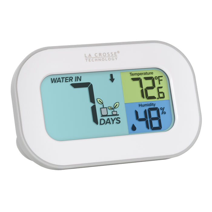 Right-facing image of the Digital plant care watering timer 919-147 with temperature and humidity.  The timer is battery-operated and features a white and gray oval case with a screen sectioned into three colors. The turquoise blue section displays how many days since the last watering, 7,  with a graphic of plants and an up arrow, the yellow section lists the temperature at 72.6 degrees Fahrenheit, and the dark blue section lists the humidity level at 48 percent with a water drop icon